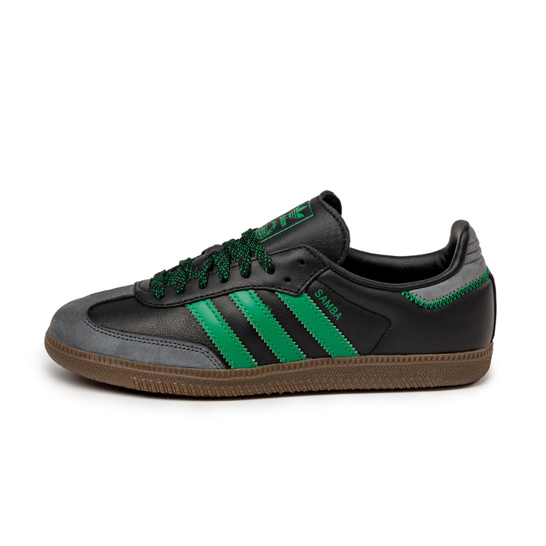 Black and green trainers on sale