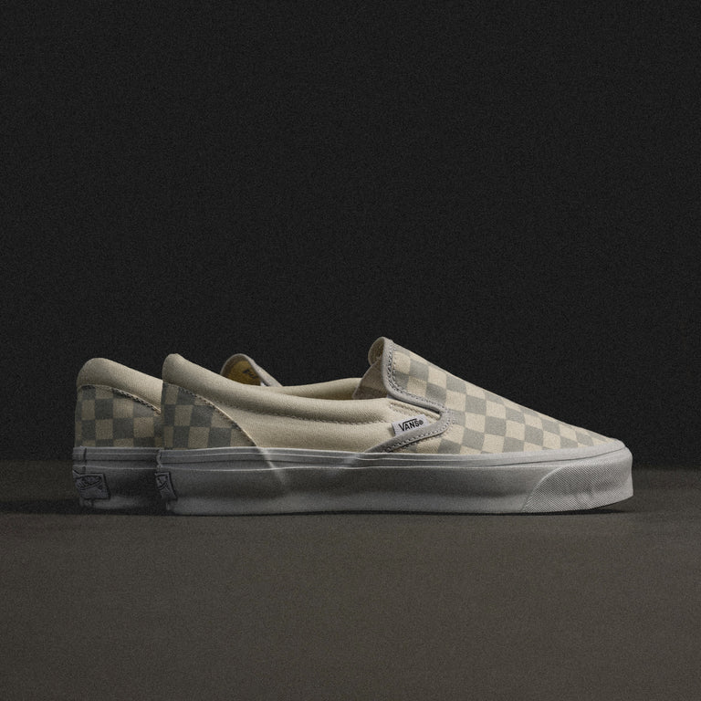 Grey checkerboard slip on vans best sale